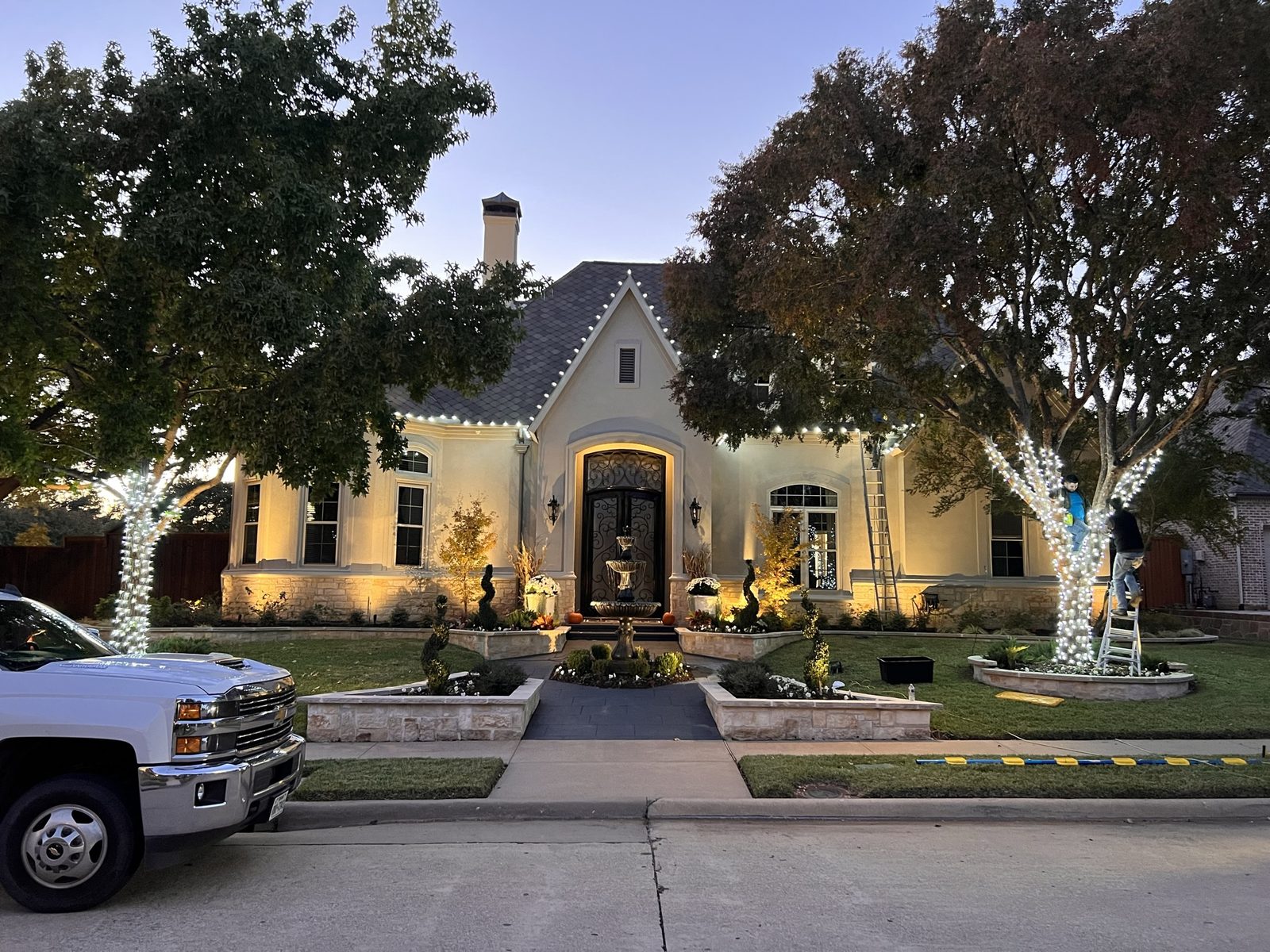 The Christmas Lights Experts truck and crew at luxury home in Plano TX