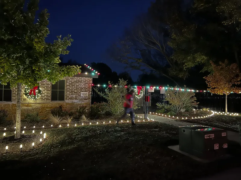 HOA Christmas light installation DFW — common area pathway lighting in a community