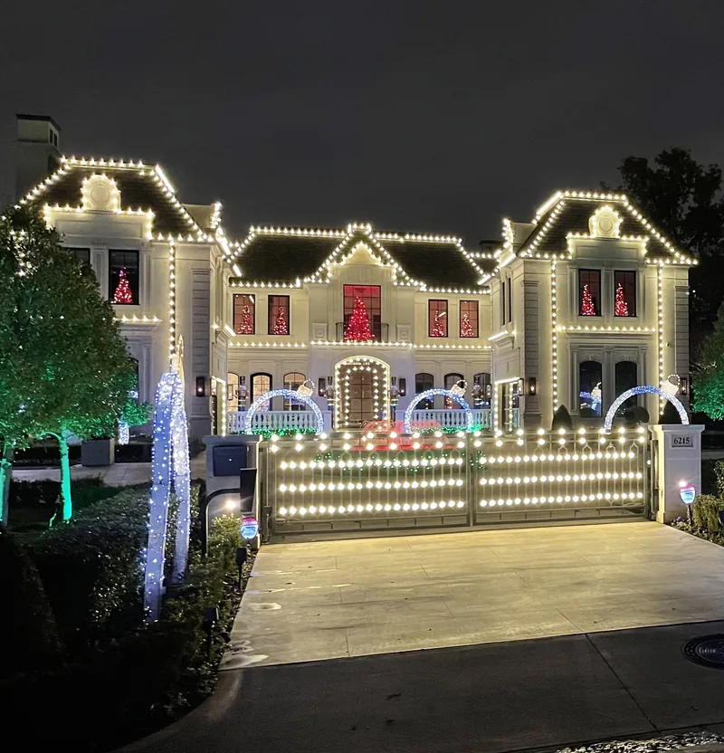 Christmas light installation Park Cities TX — warm white roofline on a Mediterranean estate