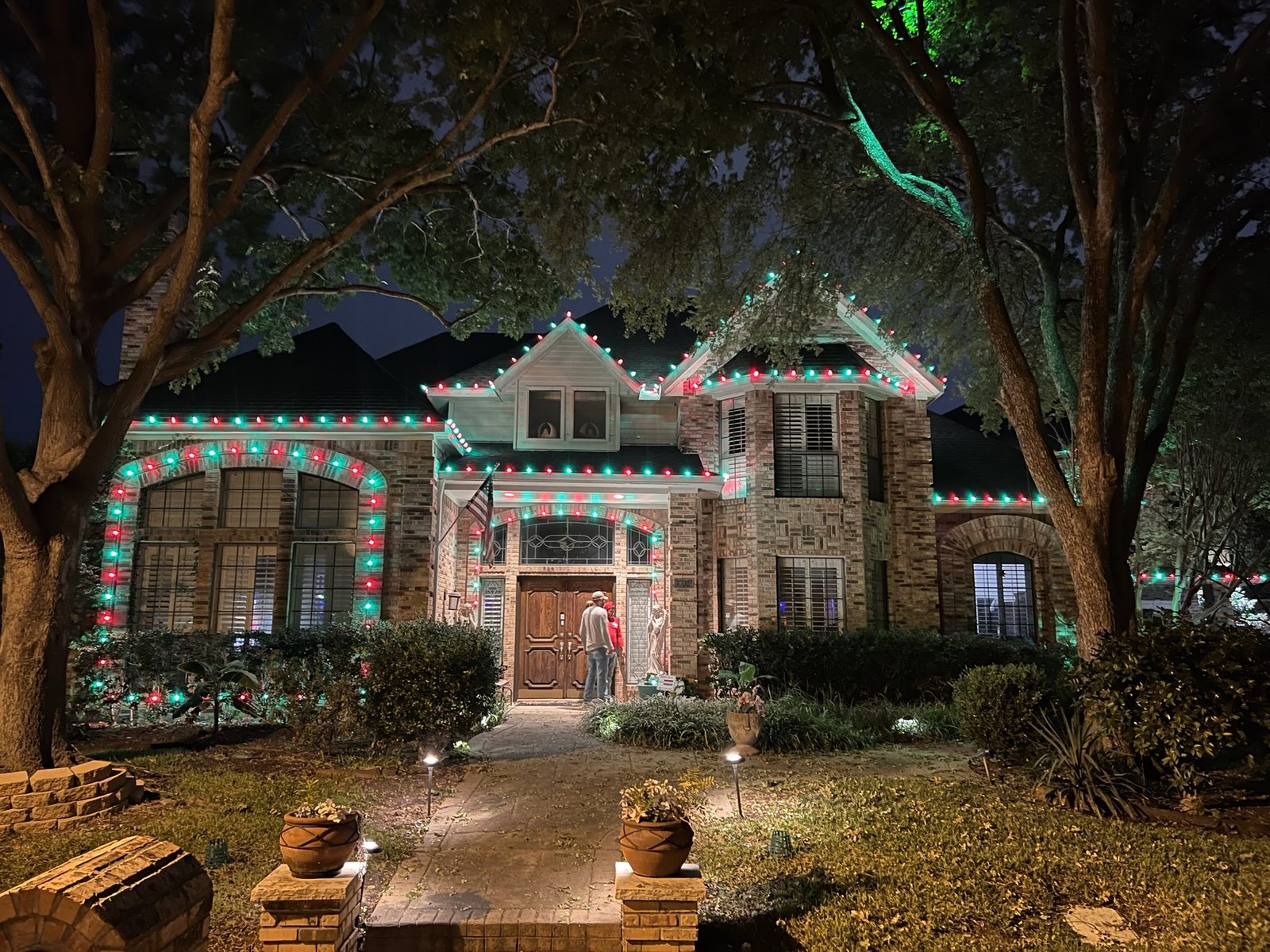 Luxury Christmas light installation Lucas TX stone estate with driveway lights